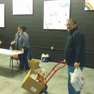 Ken Ruiz helping box and organize food at Amen House in Georgetown, Kentucky.